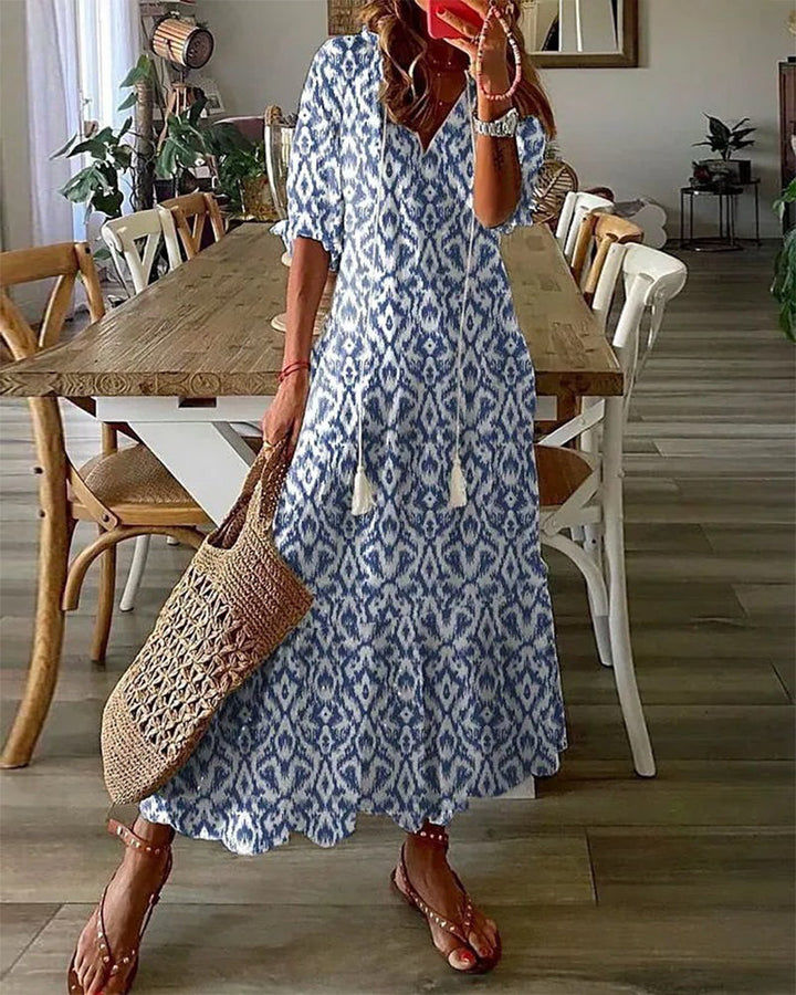 Sophia - Vintage Boho Sommerkleid mit V-Ausschnitt" can be rewritten as:

"Sophia - Bohemian Vintage Sommerkleid mit V-Ausschnitt
