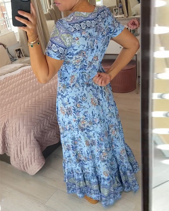 Ellie - Elegantes plissiertes V-Ausschnittkleid mit floralem Design