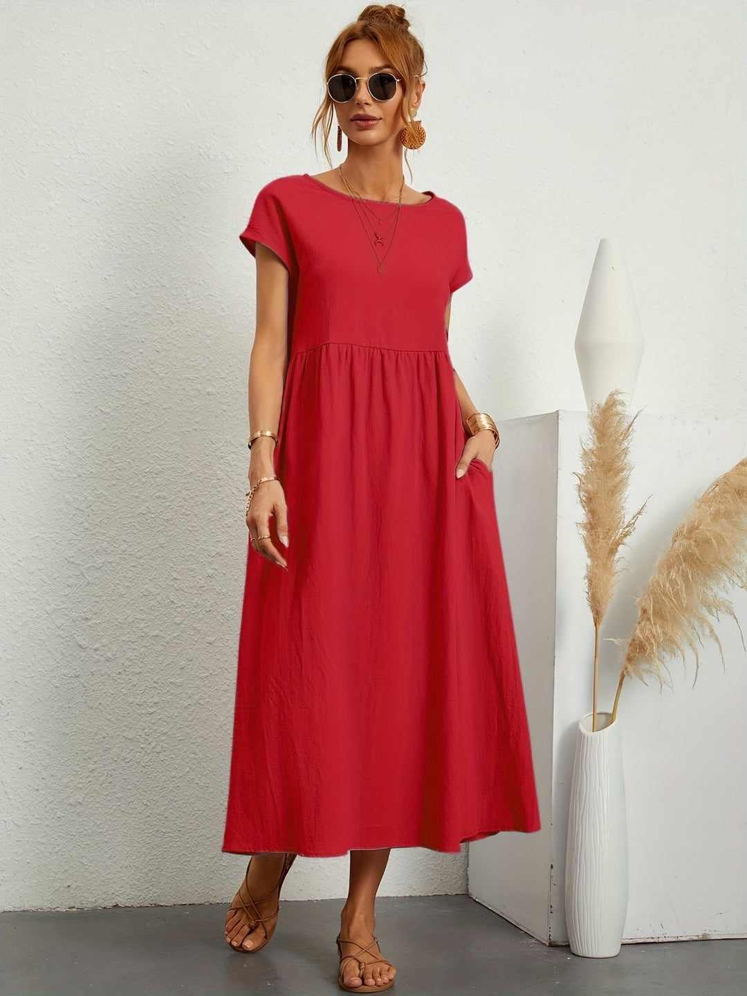 "Kimber - Midi-Relaxed Kleid mit Rundhalsausschnitt" could be rewritten as "Kimber - Midi-Relaxed Kleid mit Rundhalsdesign".