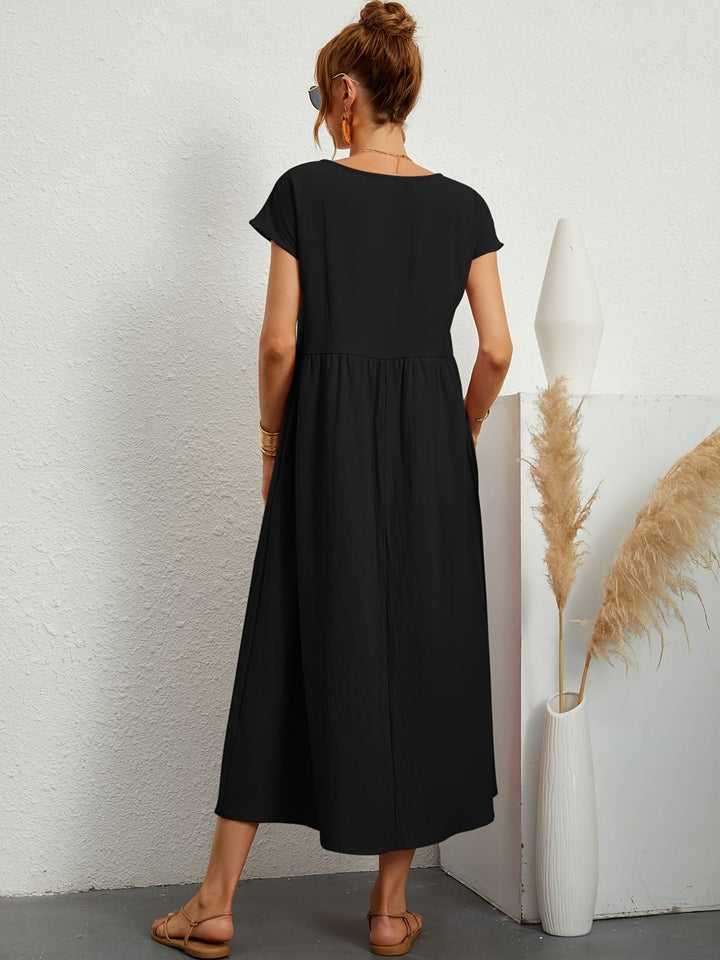 "Kimber - Midi-Relaxed Kleid mit Rundhalsausschnitt" could be rewritten as "Kimber - Midi-Relaxed Kleid mit Rundhalsdesign".