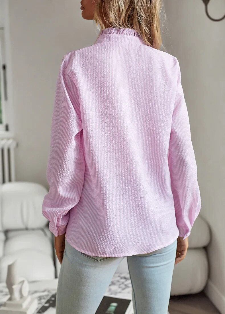 "Belle™ - Elegante Polo-Bluse" can be rewritten as "Belle™ - Chic Polo Blouse".