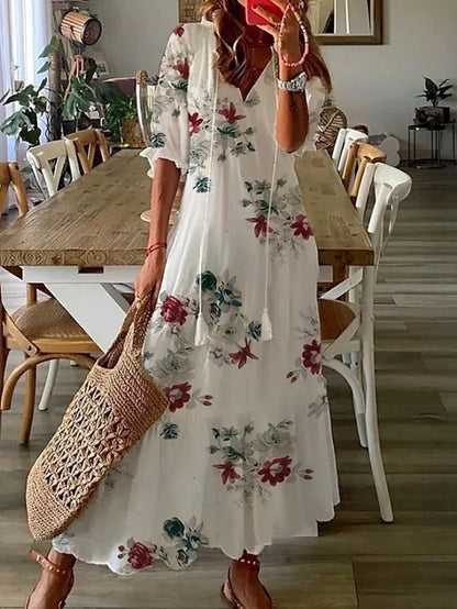 Sophia - Vintage Boho Sommerkleid mit V-Ausschnitt" can be rewritten as:

"Sophia - Bohemian Vintage Sommerkleid mit V-Ausschnitt